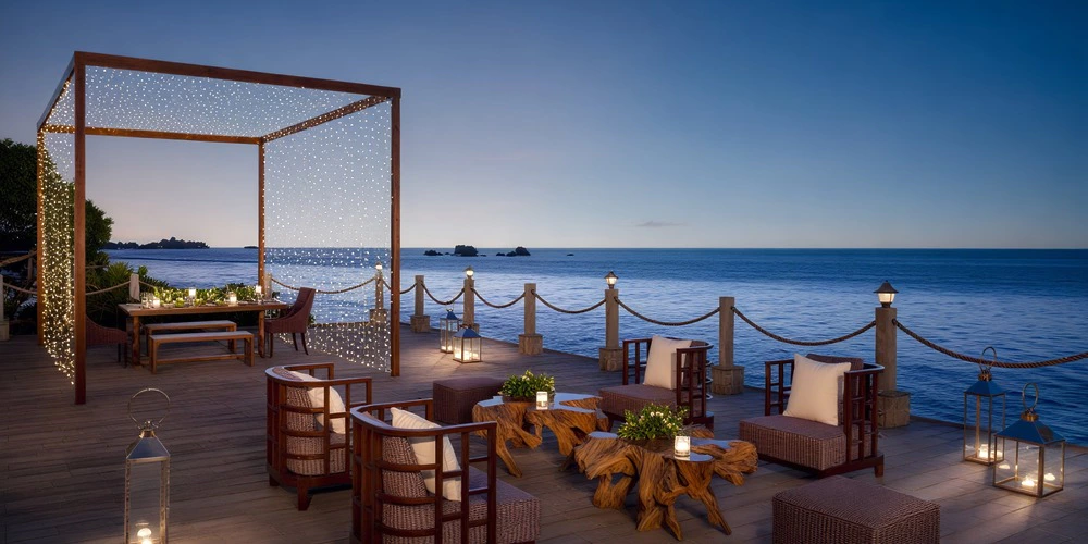Conoa Deck oceanfront lounge and private dinner setup at sunset at Zoëtry Montego Bay Jamaica