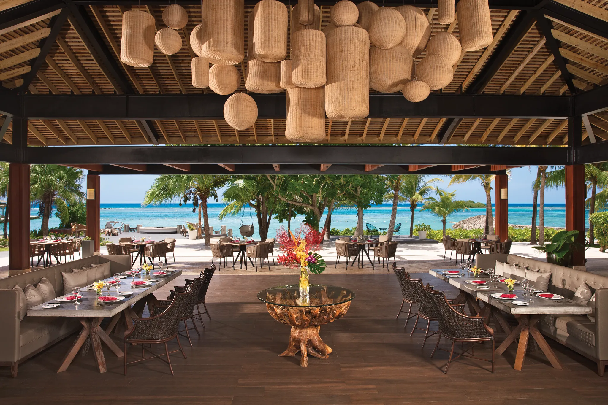 Coyaba Bar at Zoëtry Montego Bay Jamaica featuring an open-air oceanfront setting with Caribbean Sea views and elegant evening ambiance.