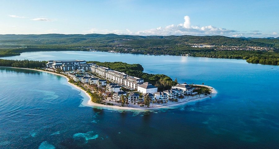 Excellence Oyster Bay adults-only all-inclusive resort in Falmouth Jamaica with overwater bungalows and Caribbean luxury.