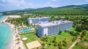 Hilton Rose Hall Resort and Spa all-inclusive Jamaica resort with large pools, waterpark, golf course, and family-friendly amenities.