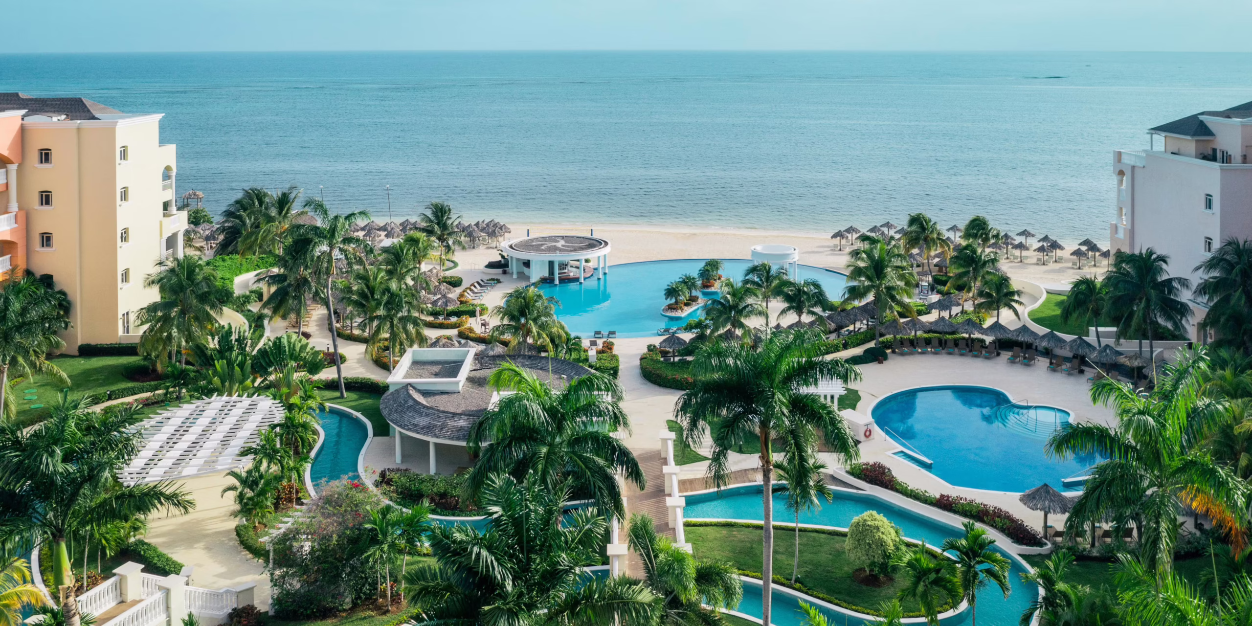Iberostar Selection Rose Hall Suites family-friendly all-inclusive resort in Jamaica with expansive pools, beach access, and lush tropical grounds.