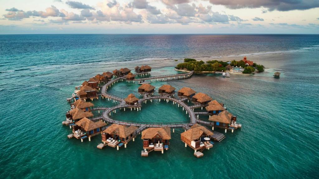 Sandals Royal Caribbean couples-only all-inclusive resort in Montego Bay with private island, overwater bungalows, and luxury amenities.
