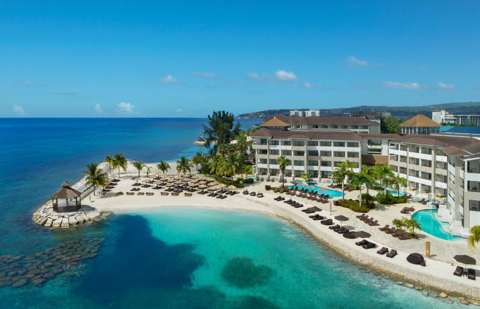 Secrets Wild Orchid Montego Bay adults-only all-inclusive resort with expansive pools, oceanfront dining, and lively atmosphere in Jamaica.