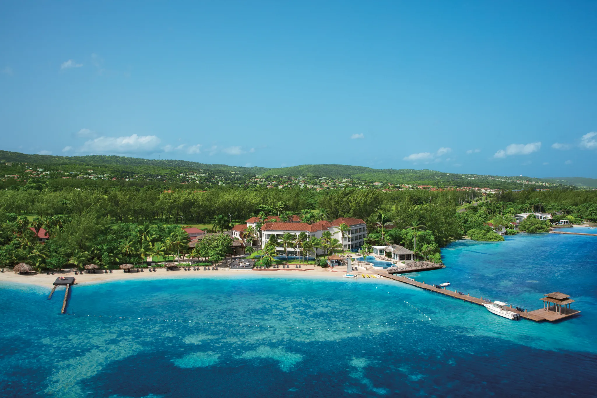 Panoramic aerial view of Zoëtry Montego Bay Jamaica showcasing the beachfront resort and surrounding tropical landscape.