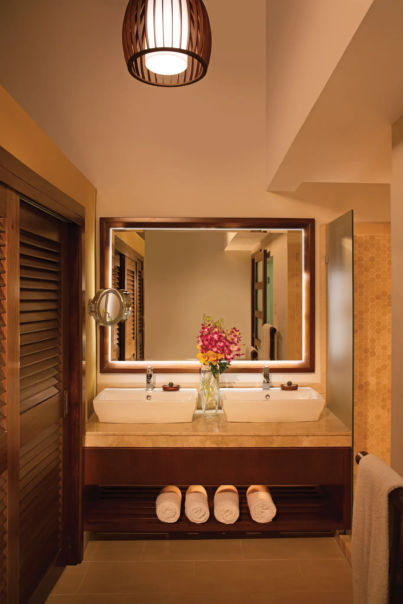 Junior Suite bathroom with double vessel sinks and illuminated mirror at Zoëtry Montego Bay Jamaica.