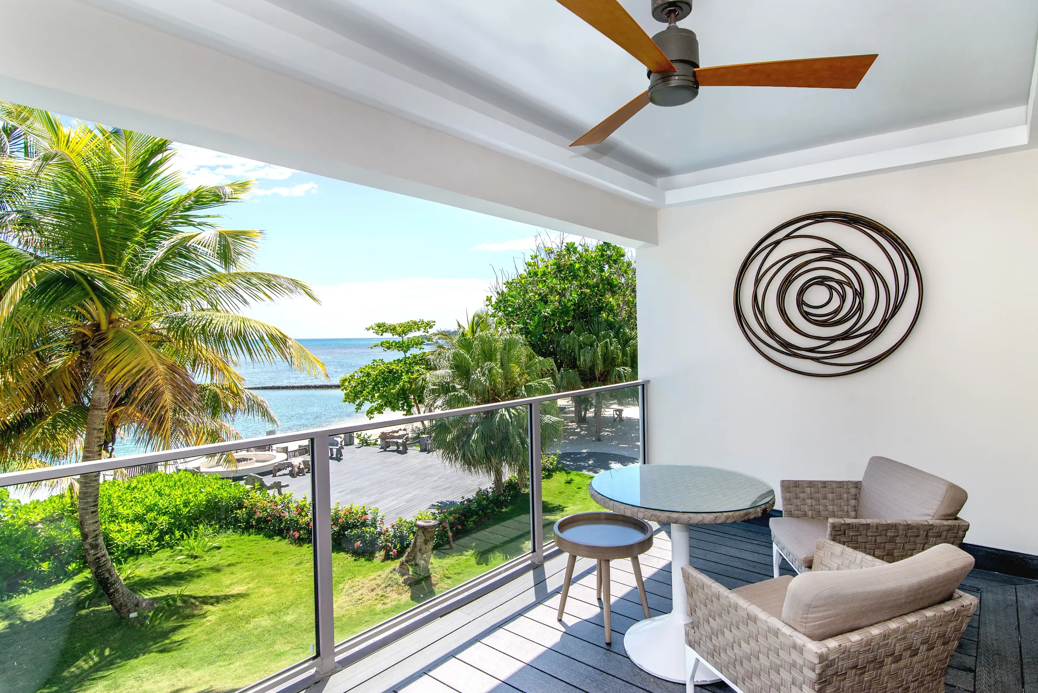 Junior Suite Ocean View private balcony with seating and ocean views at Zoëtry Montego Bay Jamaica.