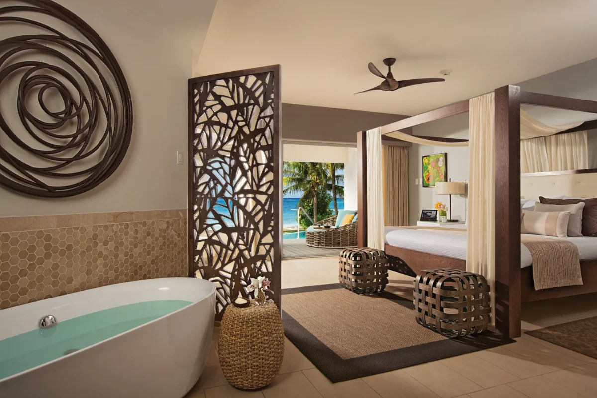 Junior Suite Swim Out Ocean View soaking tub and bedroom at Zoëtry Montego Bay Jamaica.
