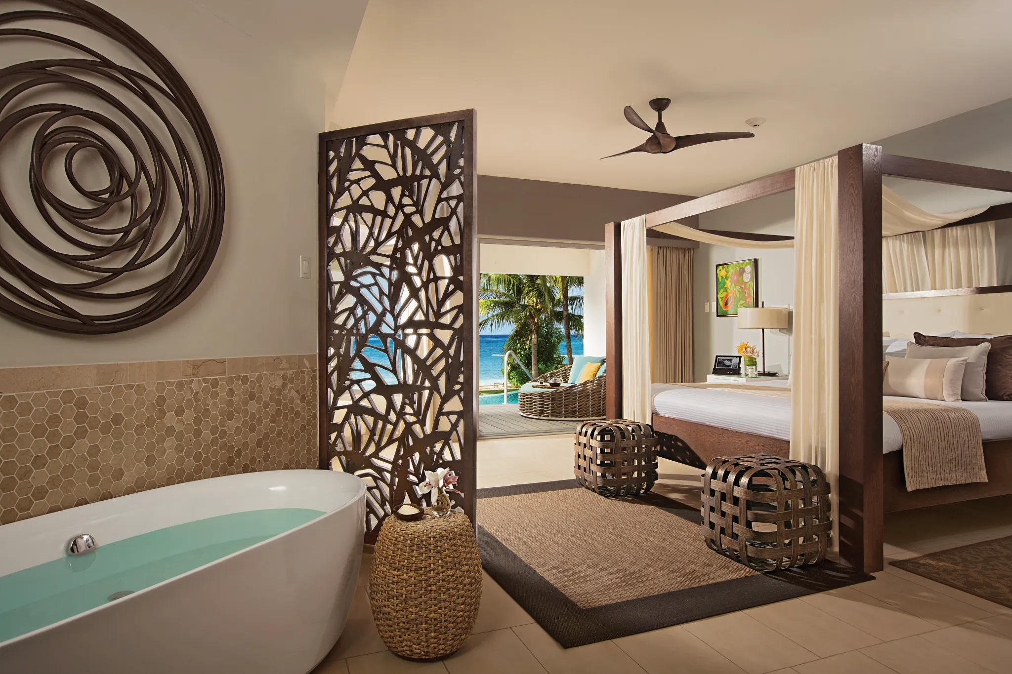 Junior Suite Swim Out Ocean View soaking tub and bedroom at Zoëtry Montego Bay Jamaica.