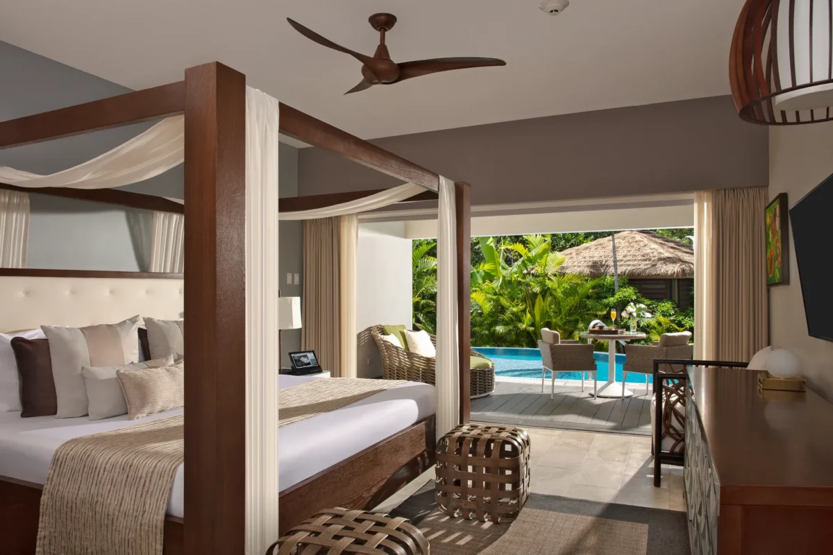 Junior Suite Swim Out Tropical View with king bed and private pool terrace at Zoëtry Montego Bay Jamaica.