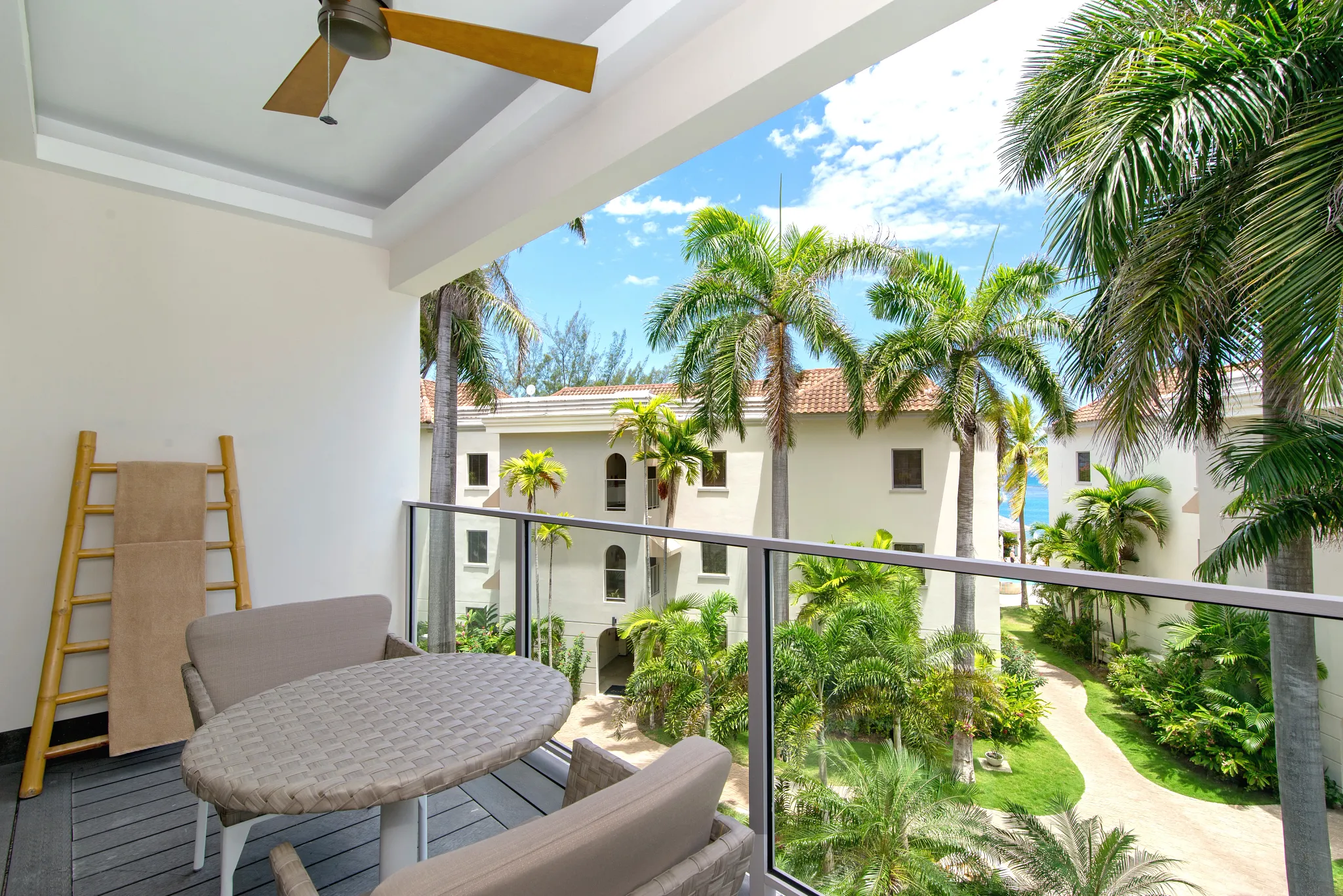 Junior Suite Tropical View balcony with garden and palm views at Zoëtry Montego Bay Jamaica.