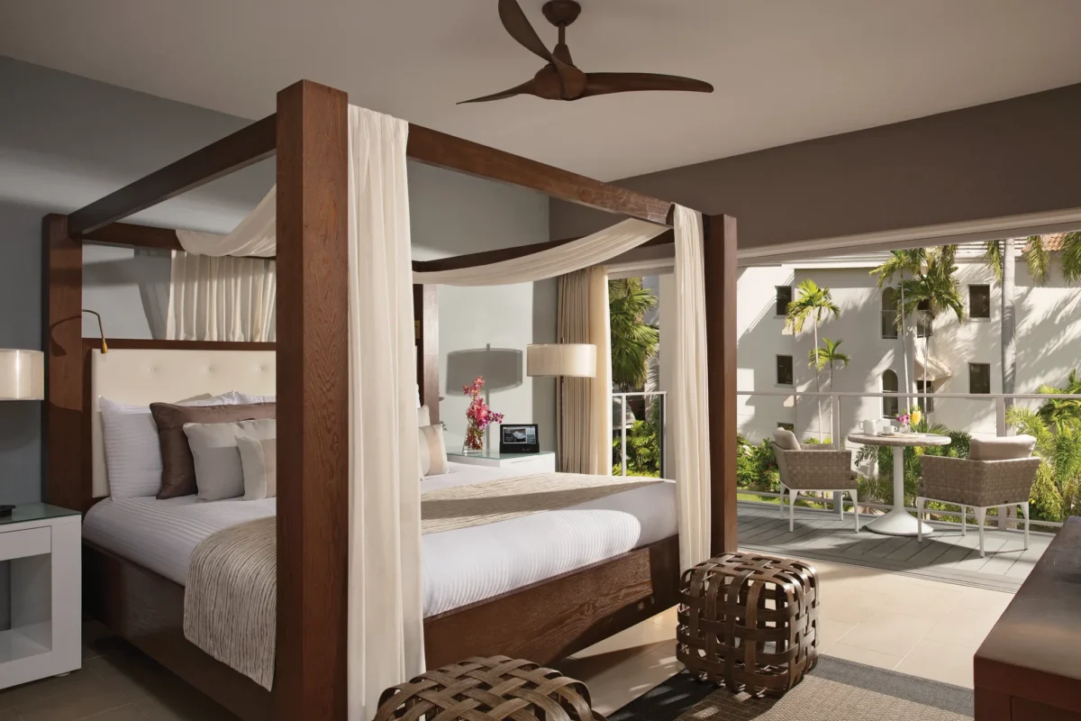 Junior Suite Tropical View with king canopy bed and private terrace at Zoëtry Montego Bay Jamaica.