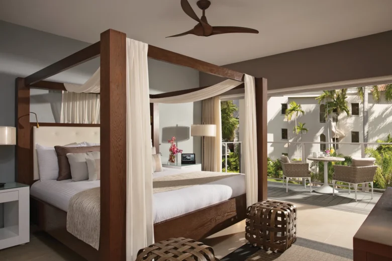 Junior Suite Tropical View with king canopy bed and private terrace at Zoëtry Montego Bay Jamaica.