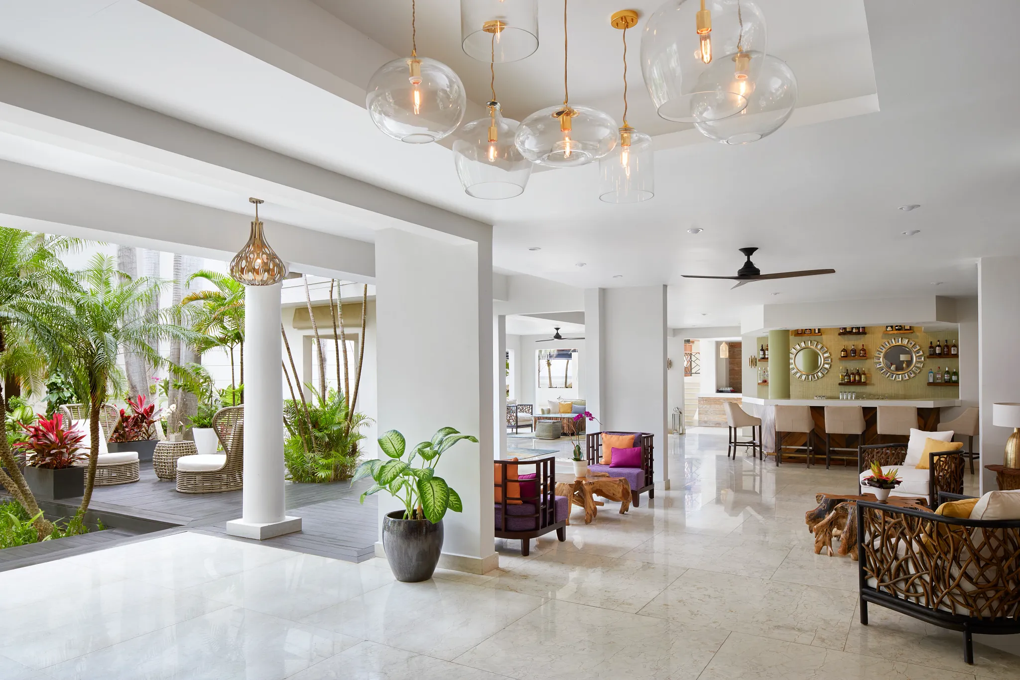 Stylish open-air lobby bar and lounge area at Zoëtry Montego Bay Jamaica with tropical décor.